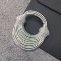 Instafamous Metal Noodles Underarm Bag with shiny metallic surface, chain detail, in gold colour