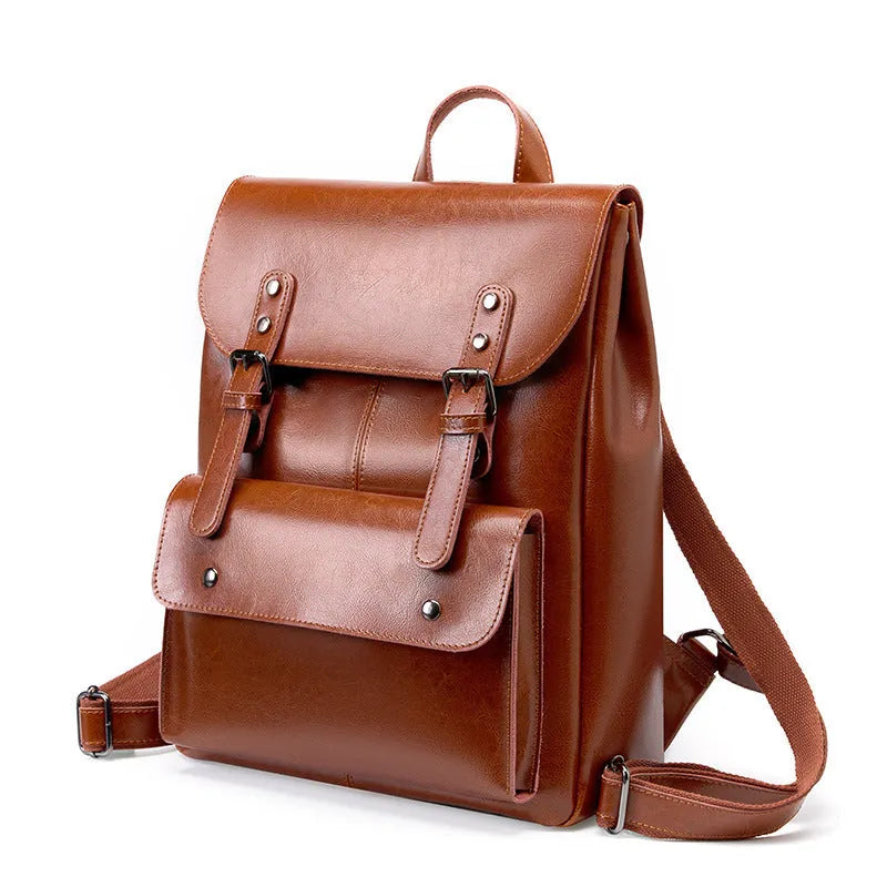 Women's structured backpack in genuine cowhide leather, shown in black, brown, and coffee colour options.