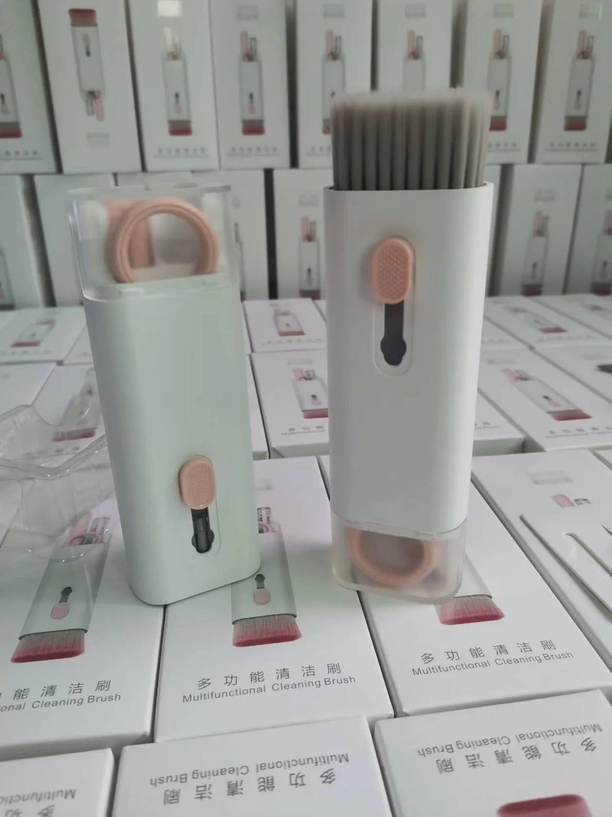 Pink and blue computer cleaning pen set with brush, keycap tool, and empty spray bottle