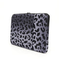 Leopard print laptop protective sleeve showing flannel interior and waterproof polyester exterior