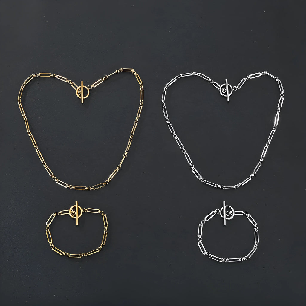 Stainless steel Chopin chain necklace and bracelet set in gold finish on white background