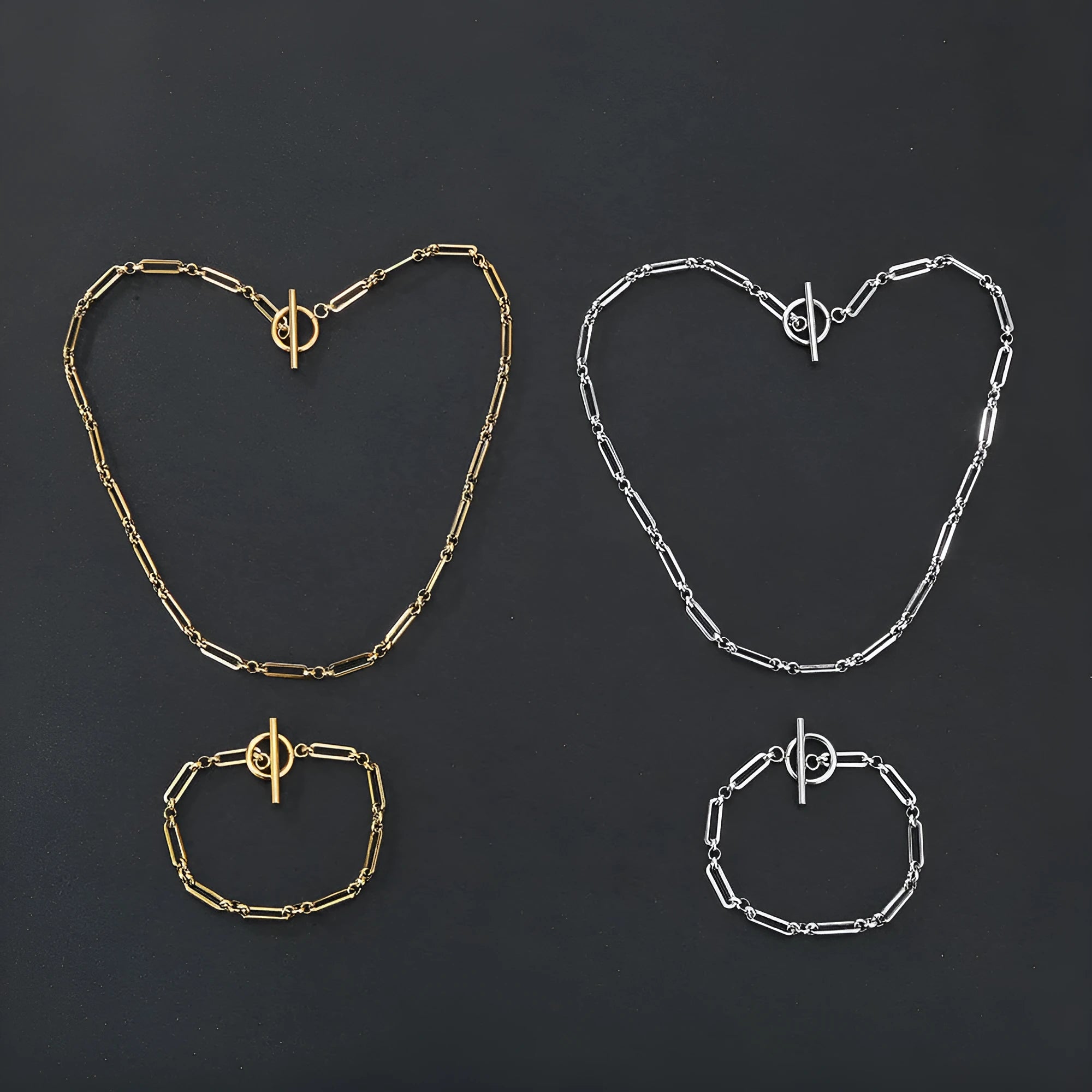 Stainless steel Chopin chain necklace and bracelet set in gold finish on white background