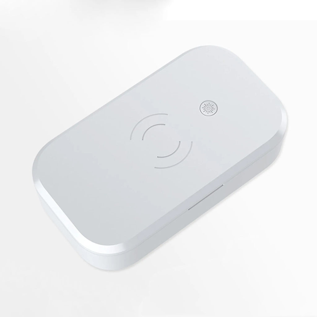 White ultraviolet disinfection box with wireless charging surface for mobile phones and beauty tool sterilisation