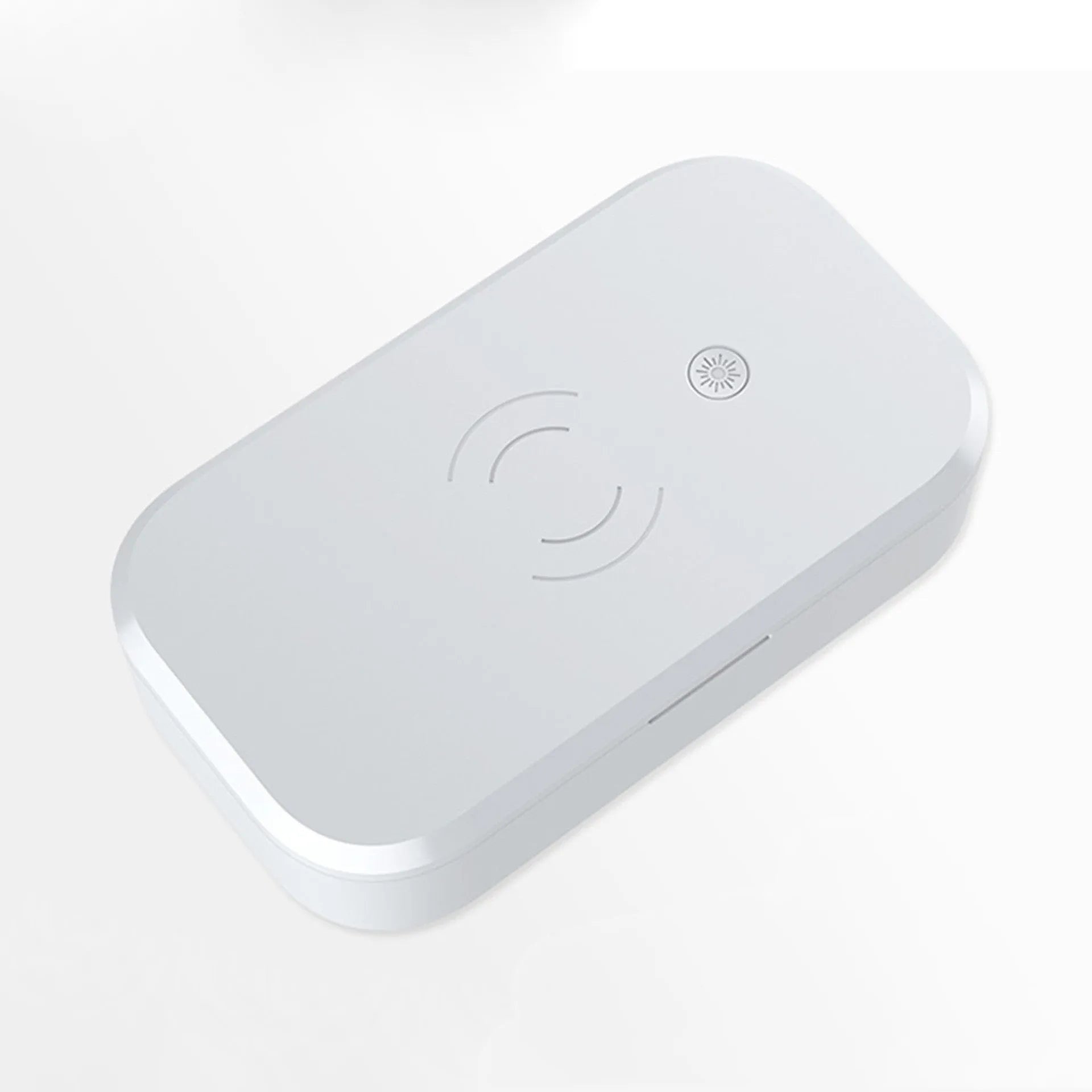 White ultraviolet disinfection box with wireless charging surface for mobile phones and beauty tool sterilisation