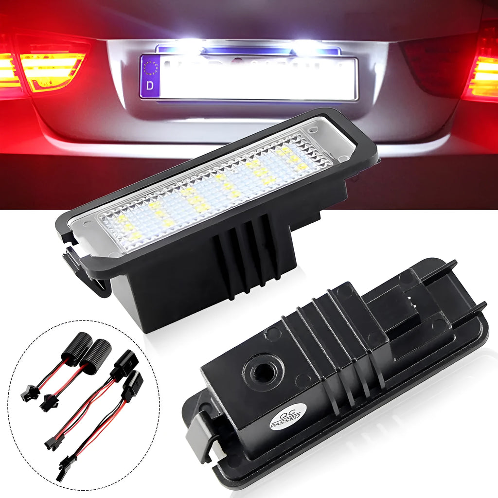 Two Volkswagen LED license plate light bulbs with white LEDs and electrical connectors.