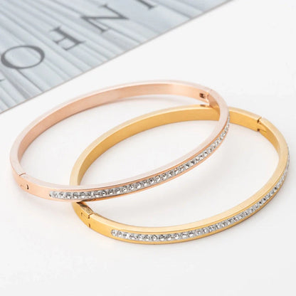 Single row stainless steel bracelet with diamond opening in gold, rose gold, or steel