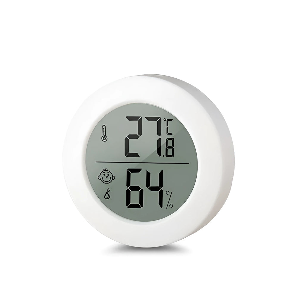 Round Smiling Face CX1030 digital temperature and humidity meter in white on a tabletop