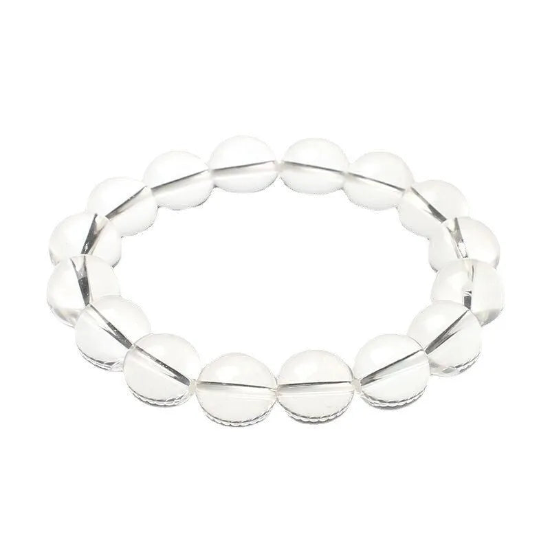Natural Donghai old mine white crystal round bead bracelet with geometric design on a wrist.