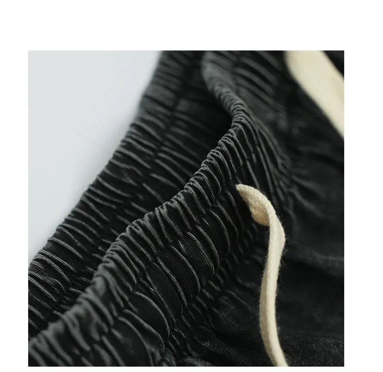 Men's vintage washed loose drawstring shorts in 100% cotton, black colour, front view