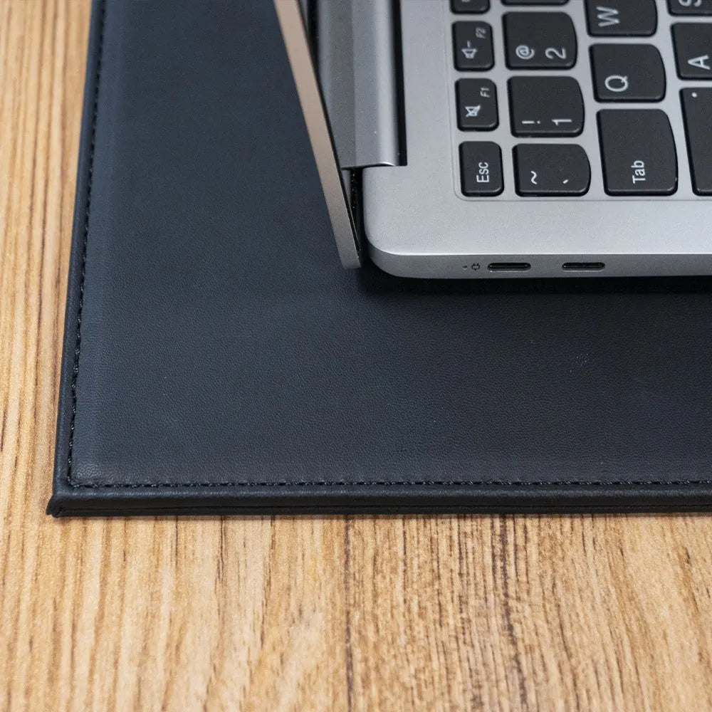 Anti-radiation printing tablet pad in colours black, black gold, blue, and green on a work surface.