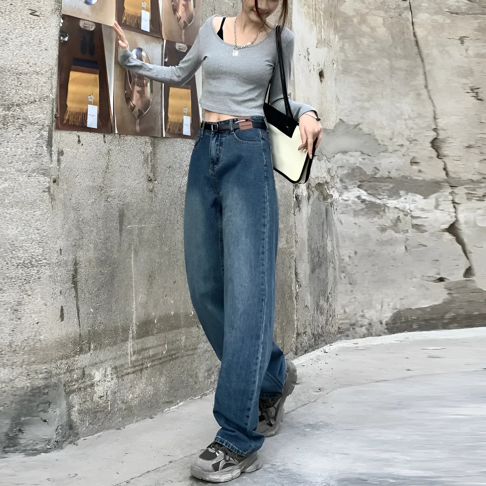 Women's retro blue high waist straight leg jeans laid flat, showing the five-pocket design and button fly.