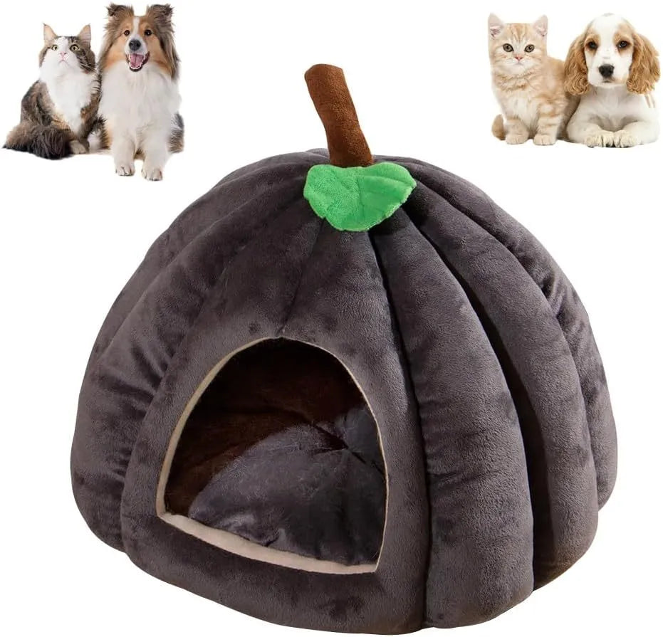 A grey pumpkin-shaped semi-enclosed cat bed with a plush interior, shown on a wooden floor.