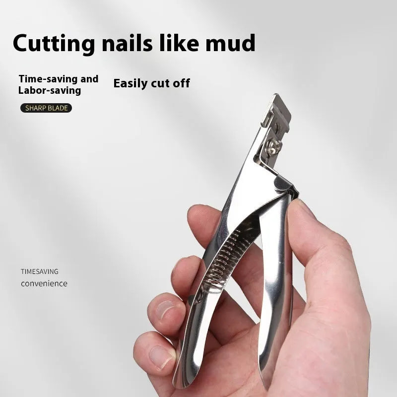 Close-up of stainless steel French U-shaped nail scissors on a plain background.