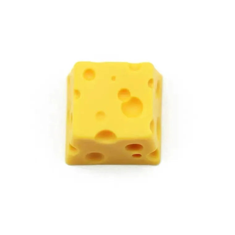 Yellow resin artisan keycap with a three-dimensional cheese design for mechanical keyboards.