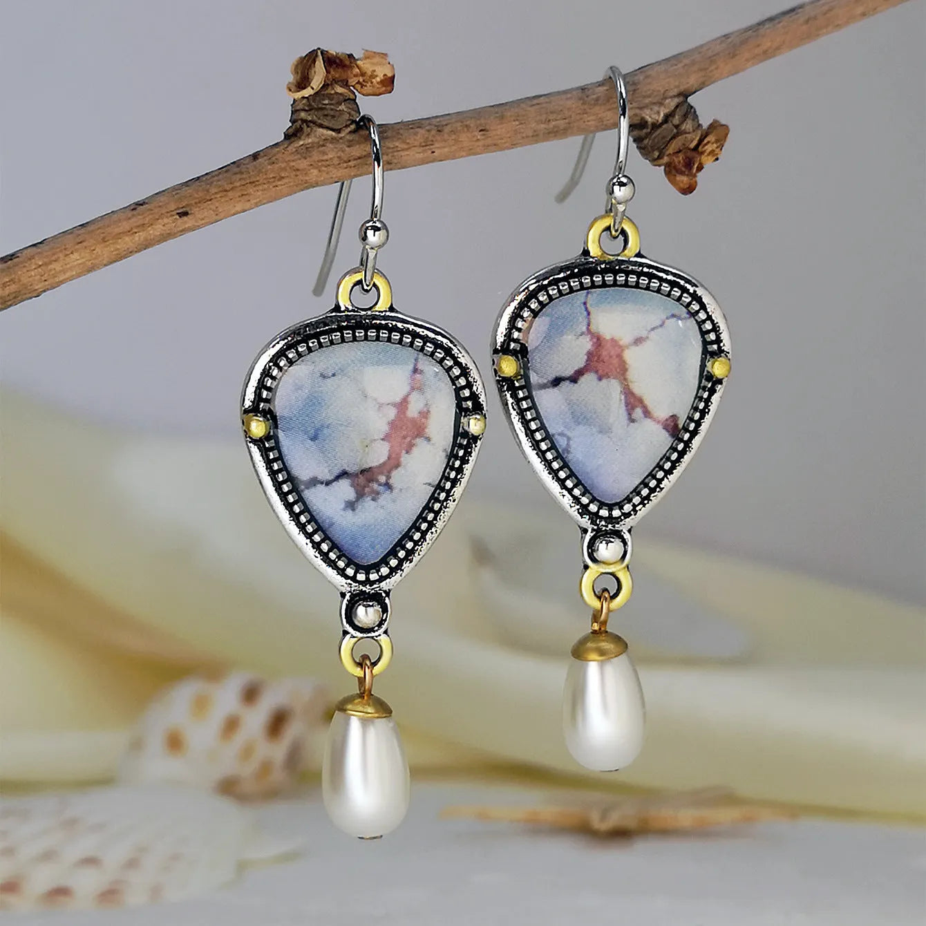 Retro blue women's drop earrings with synthetic opal, pearl, and geometric metalwork.