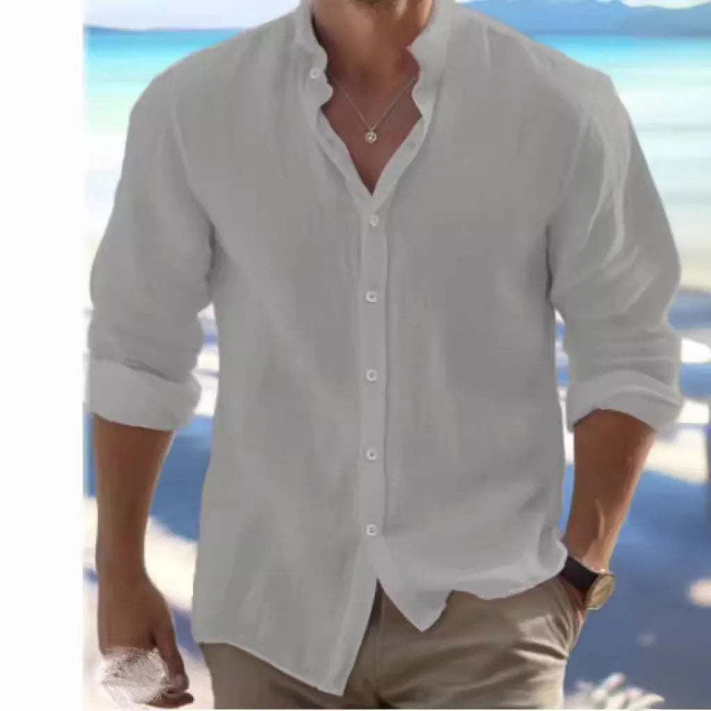 Man wearing a light blue long-staple cotton pullover summer shirt with casual collage stitching details.