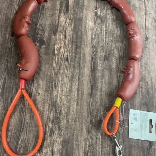 Brown dog rope toy with sausage segments and hand grip measuring 108cm length