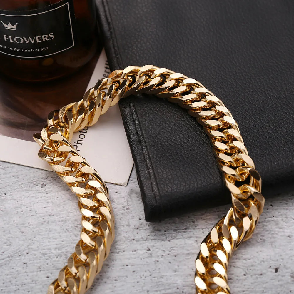 Gold coloured women's thick chain necklace on a white background.