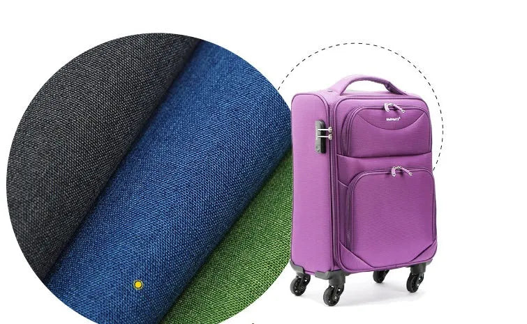 A black, blue, and green polyester ant cloth laid flat, used as a protective cover on a piece of luggage.