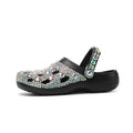 Black women's platform sandals with rhinestone detail on EVA upper and thick sole.