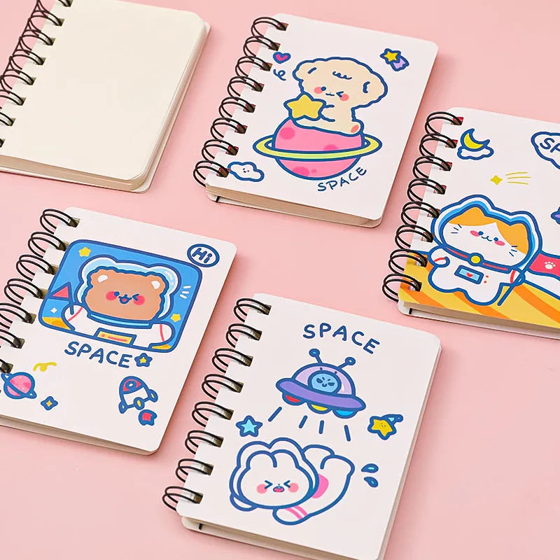 Astronaut themed pocket flipper notebook showing 10.5 by 8 cm dimensions with space cat cover design