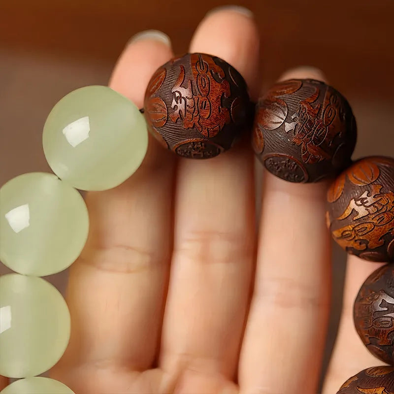 Rosewood bracelet with carved Fu character and amass fortunes motif on 20mm beads