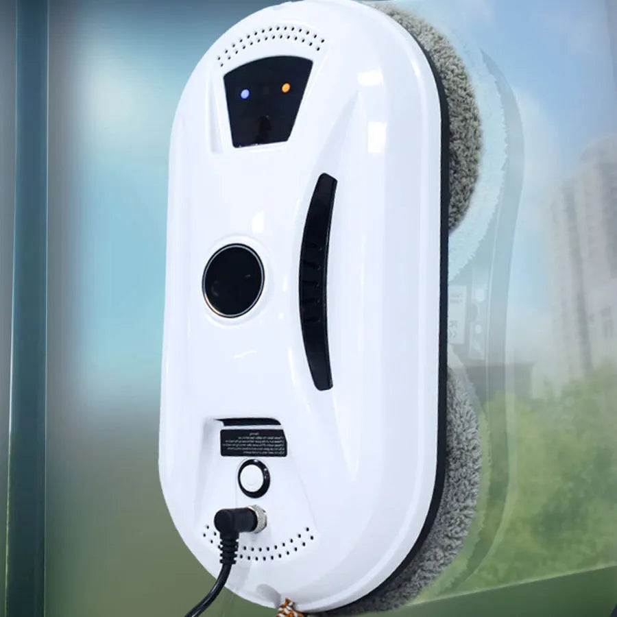 White automatic window cleaning robot HCR-02 with remote control, 28cm long, on a glass surface