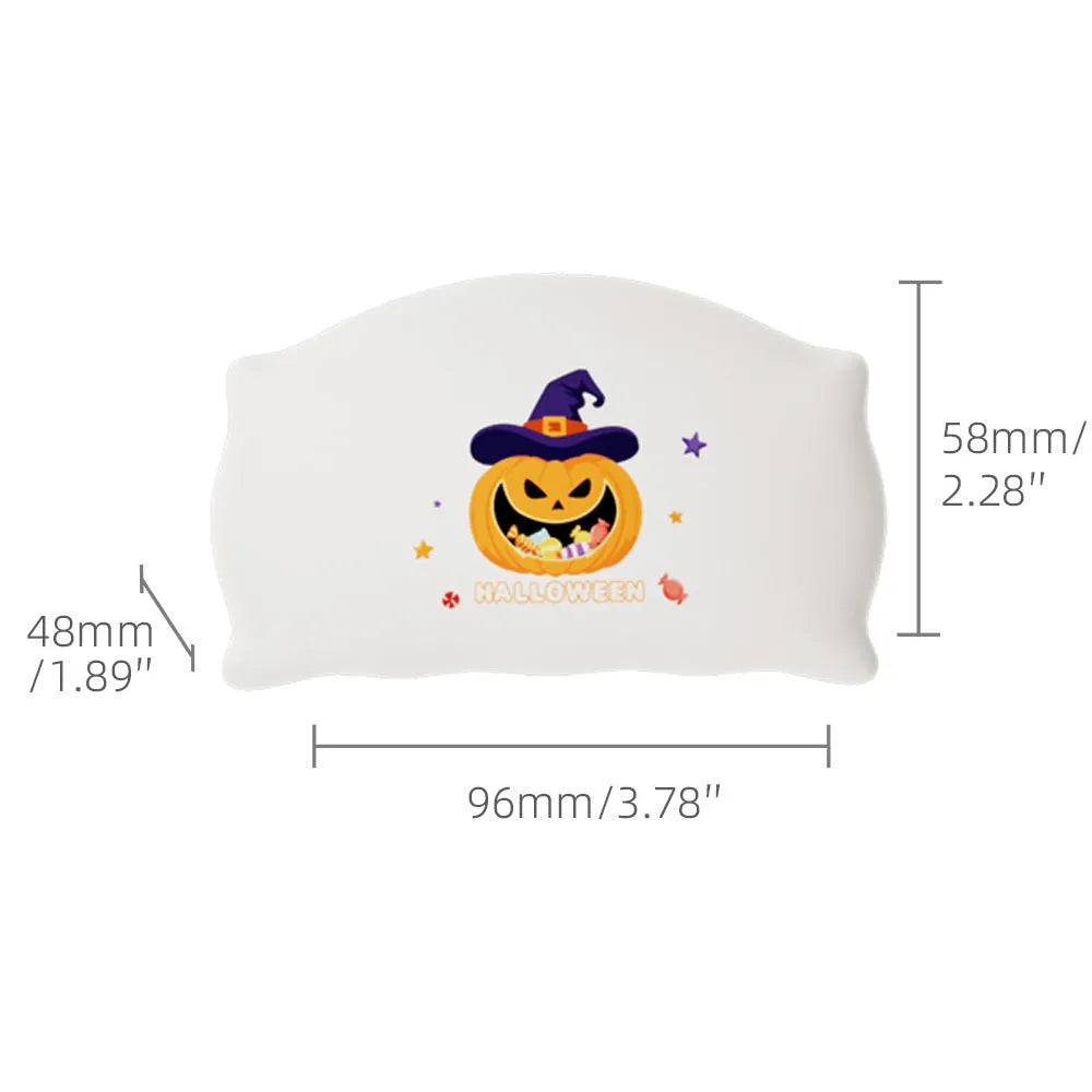 Cartoon Halloween ghost or pumpkin doll table lamp with warm white LED light on a table.