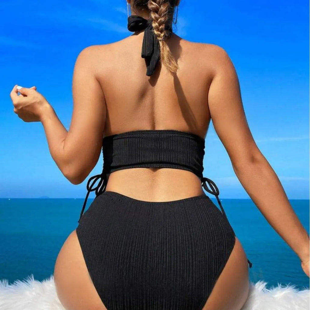 Women's black lace-up halter bikini set with matching briefs on white background