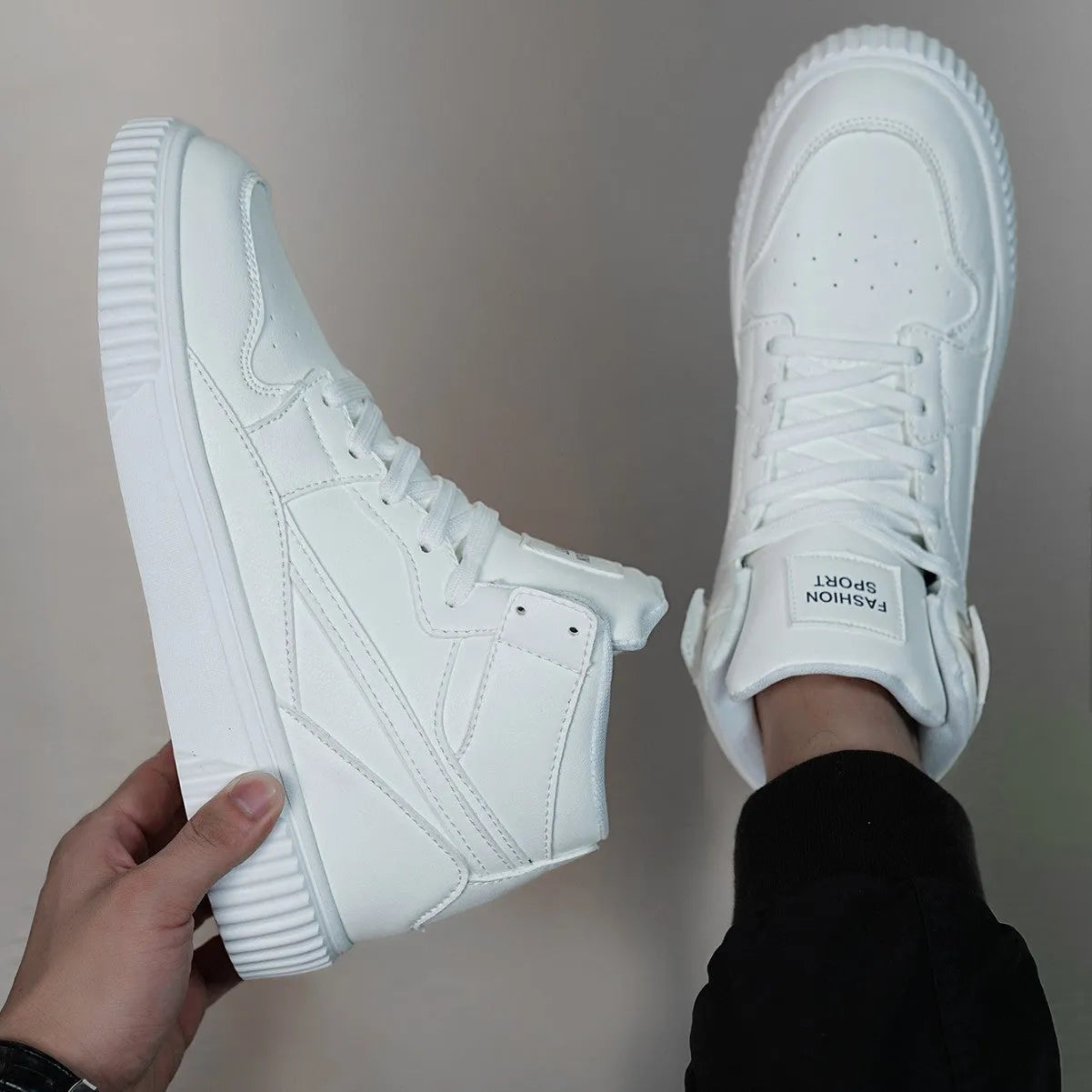 White men's casual slip-on shoes with a round toe and microfiber upper on a solid background.