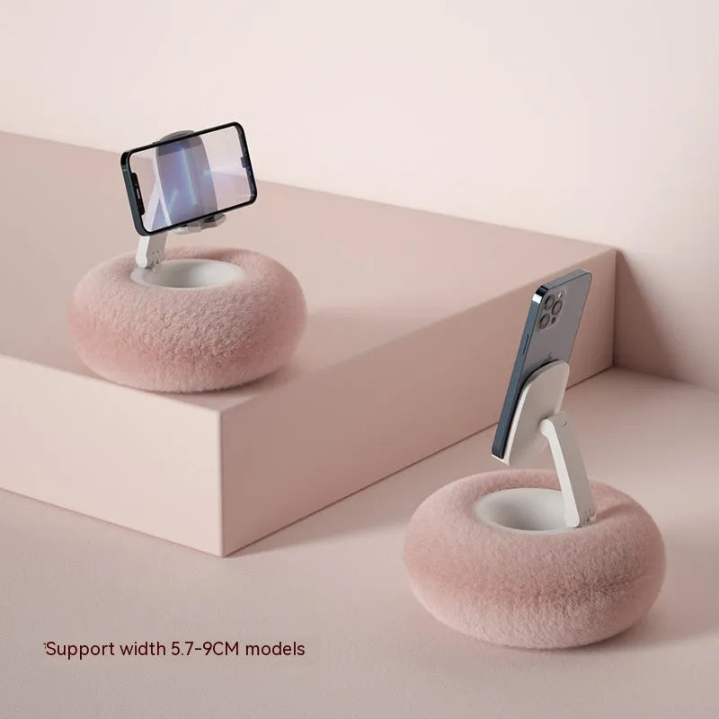 Adjustable rotating desk bracket holding a tablet, showing height extension and clamp mechanism.