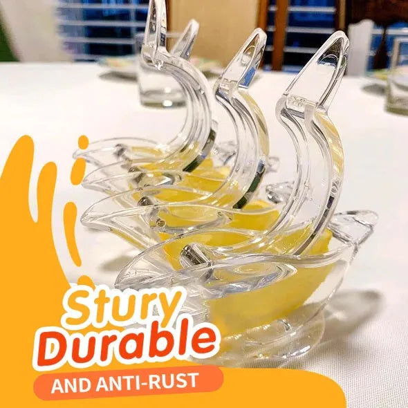 Transparent acrylic manual lemon juicer in the shape of a bird on a kitchen counter.