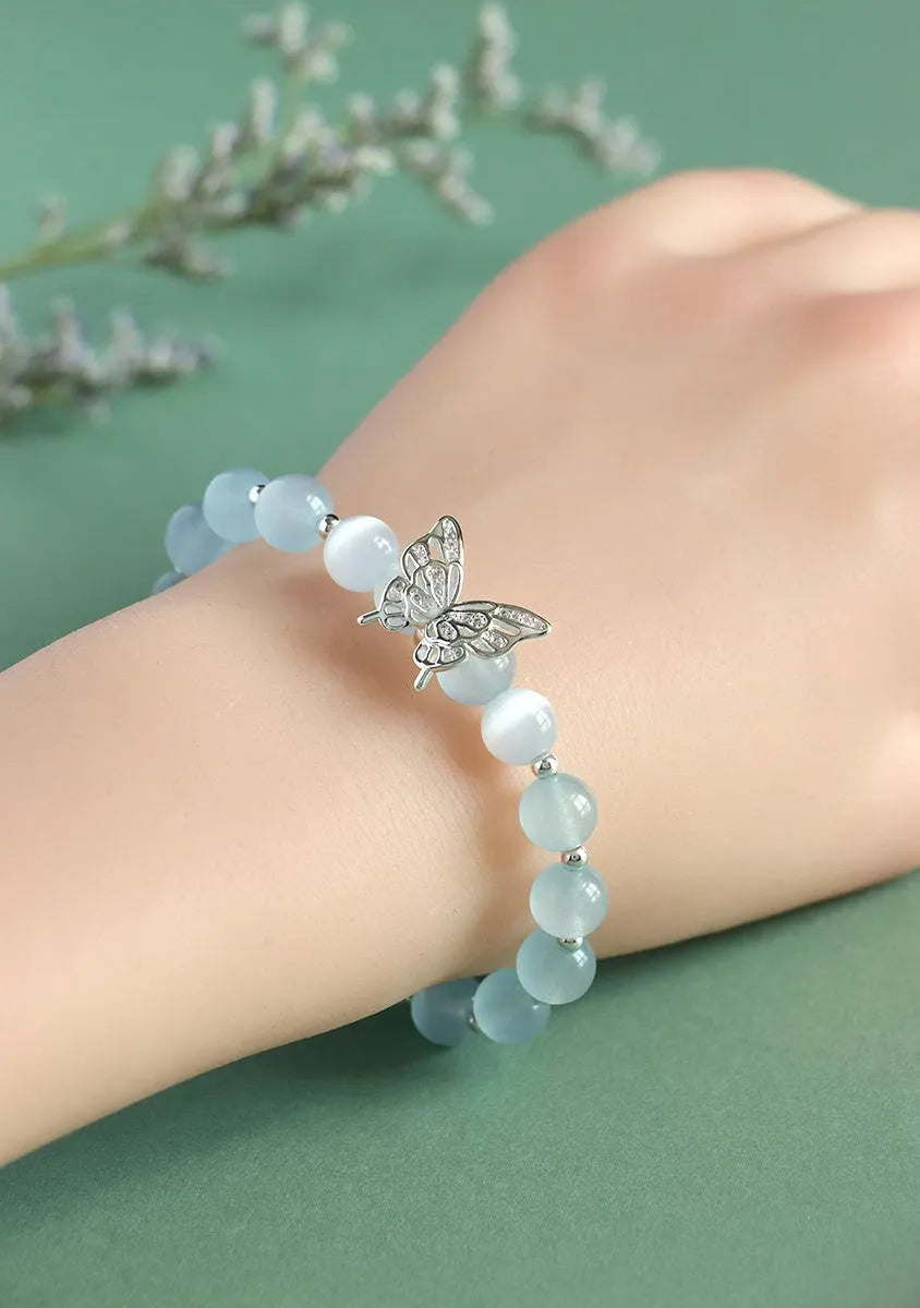 Women's crystal cat eye bracelet with butterfly charm and bow design in princess style