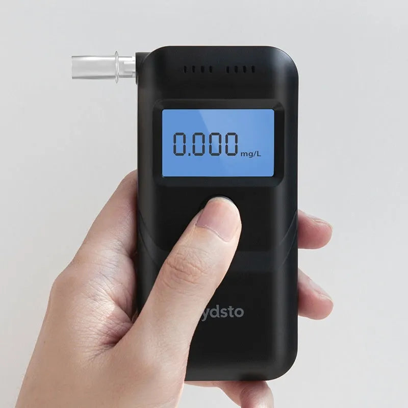 Black household alcohol tester breathalyser with digital display for breath alcohol detection