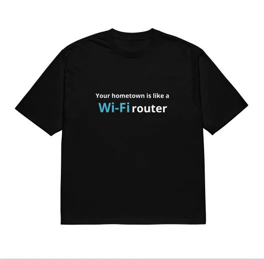Man wearing a black loose-fit t-shirt with a large 3D digital printed cartoon design on the front.