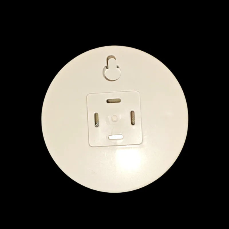 Round small night lamp with side push key, 86mm diameter, white housing, glowing warm light on a wooden nightstand
