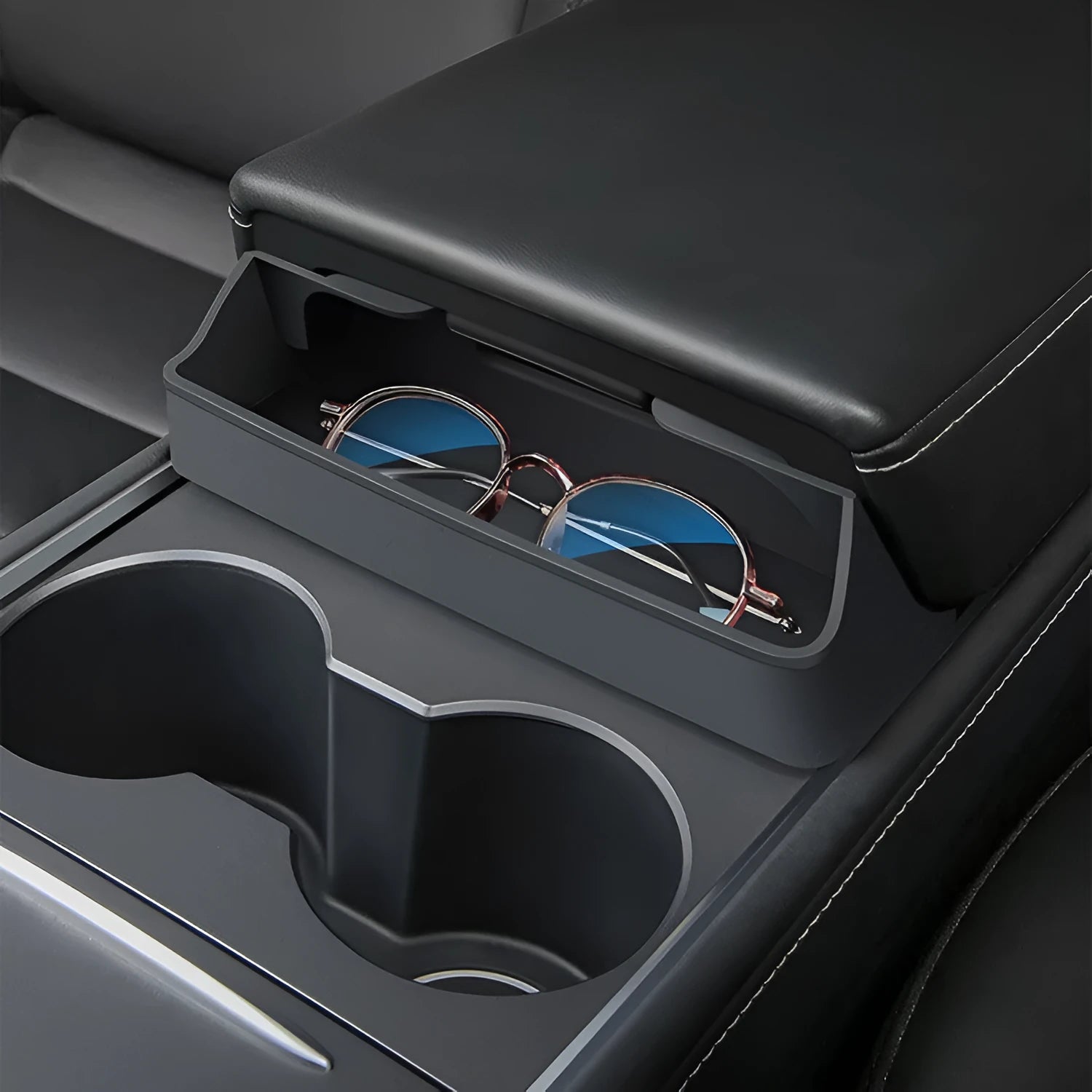 Black silicone glasses case mounted in Tesla Model 3/Y centre console