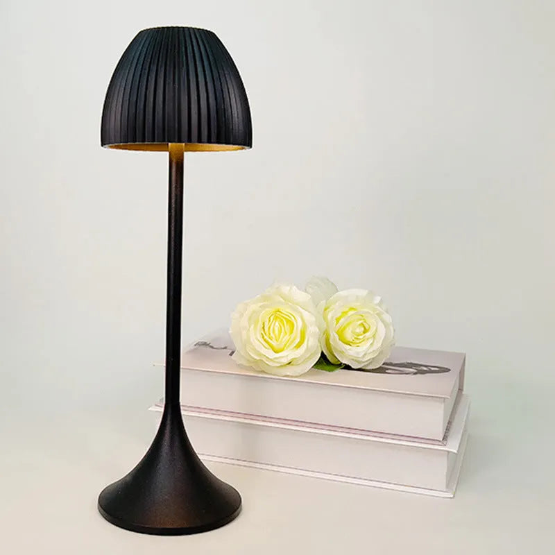 Small modern table lamp with dimming function on thin round base in black finish