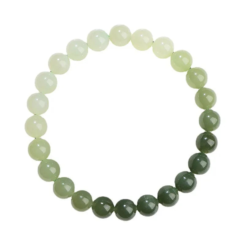 Natural Hetian jade bracelet with gradient water colour round beads on a wrist