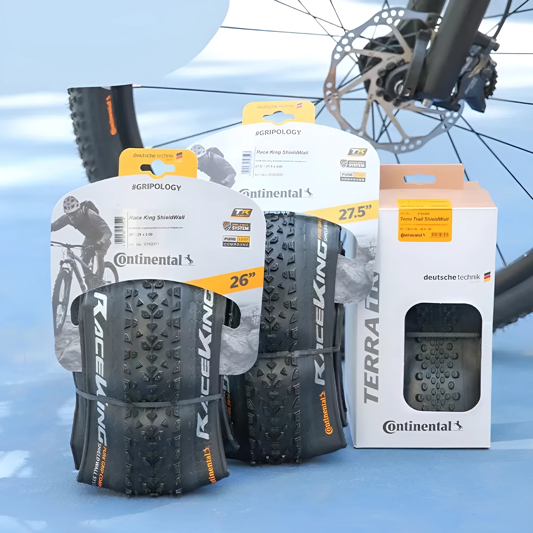 Mountain bike folding outer tyre shown in yellow, with size markings for 27.5x2.2 visible.