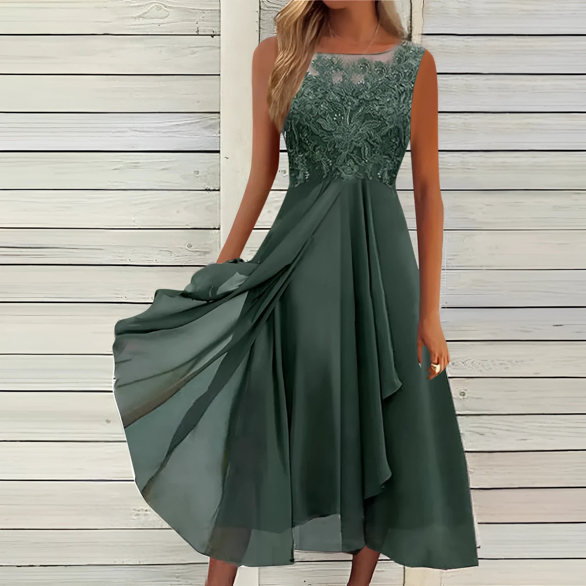Women's sleeveless green chiffon dress with lace hollow-out stitching detail, midi length.