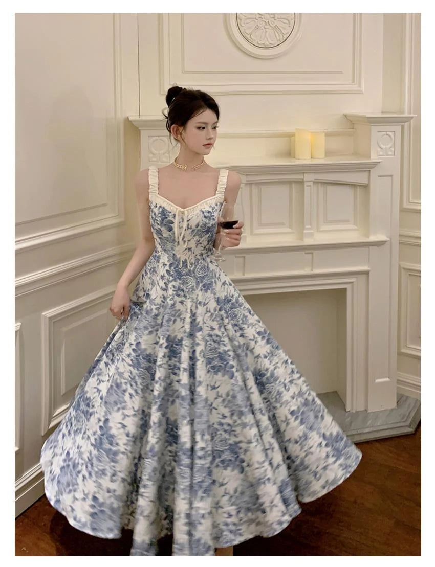 Retro women's floral strap dress in navy blue with high waist and A-line skirt