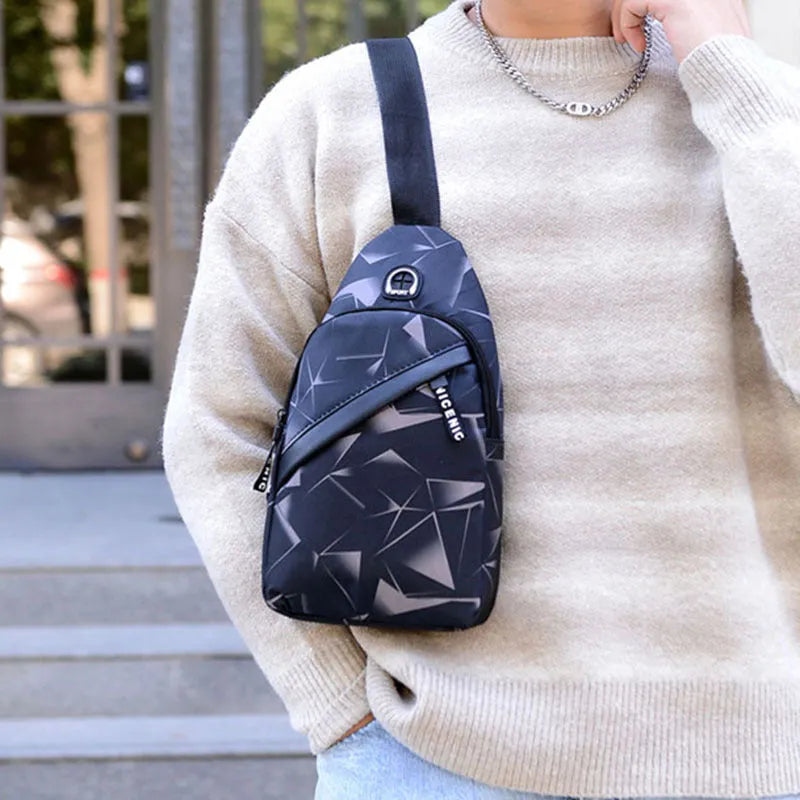 A blue print sling chest bag for men with an earphone hole, shown in a square vertical crossbody style.