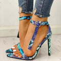 Blue women's high heel shoe with buckle closure, pointed toe, and hollow-out detail on artificial PU leather.