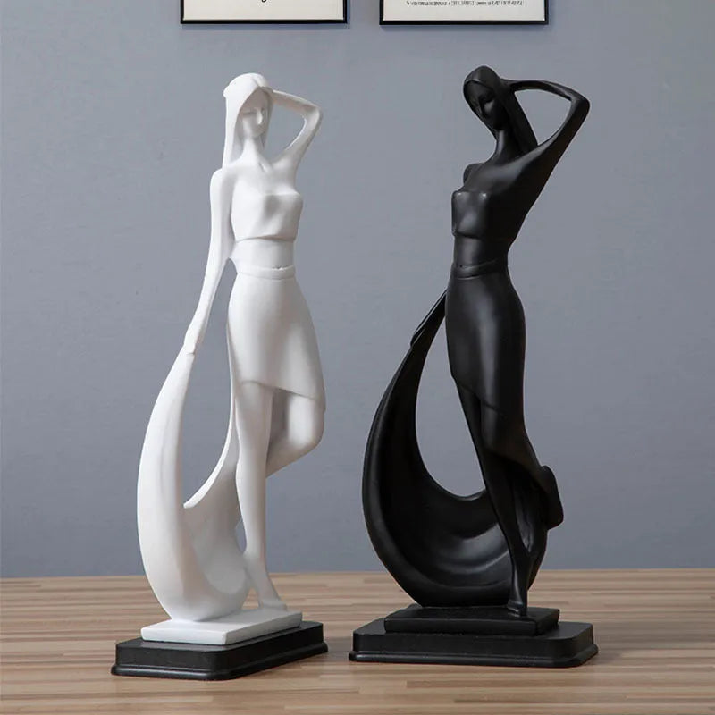 Resin abstract smart dancer sculpture in sub-white finish on a shelf, modern home decoration