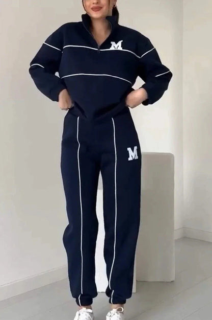 Comfortable and stylish two-piece loungewear set for women, featuring a hoodless pullover sweatshirt and relaxed-fit sweatpants with pockets.