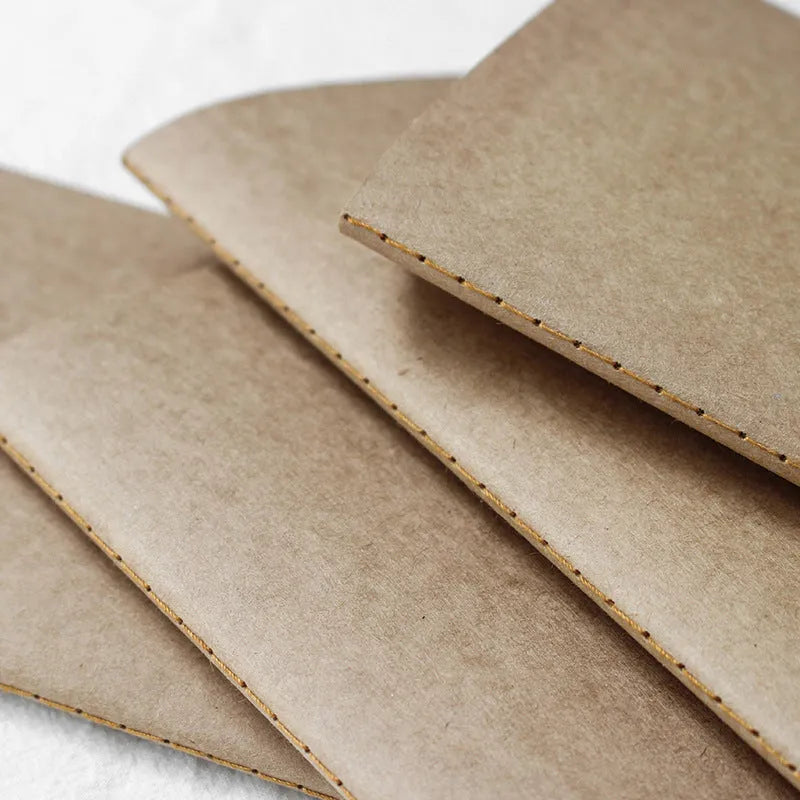 Travel cowhide diary refill inner core showing 11x21cm size and saddle stitch binding