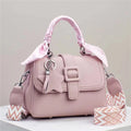 Solid colour handbag in beige with crocodile pattern texture, featuring a zippered top and interior organisation pockets