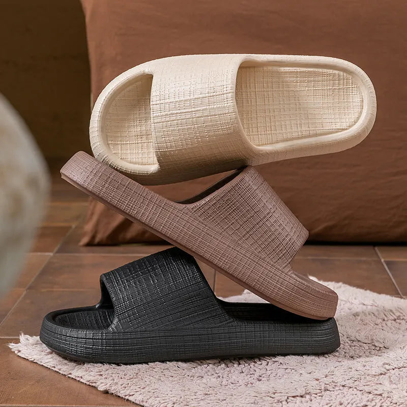 A pair of soft-bottom EVA bath slippers with a toe ring and non-slip sole, shown in one of five available colours.