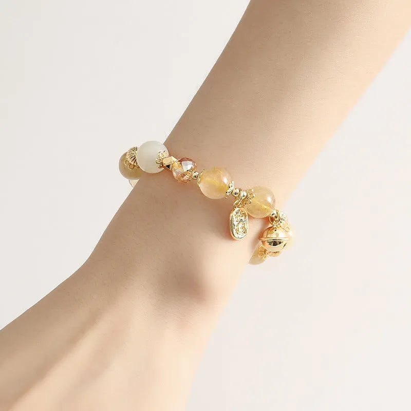 Gold electroplated adjustable chain bracelet with a rutilated quartz crystal in Lucky Fortune colour.
